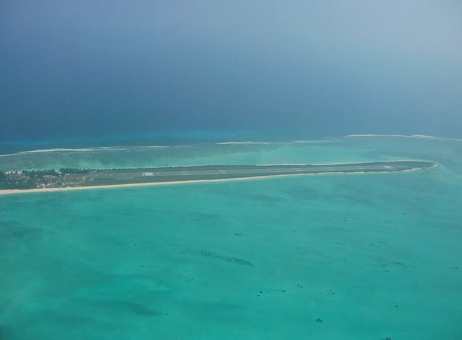 The narrow palm-covered island of Agatti surrounded by a turquoise lagoon in Lakshadweep