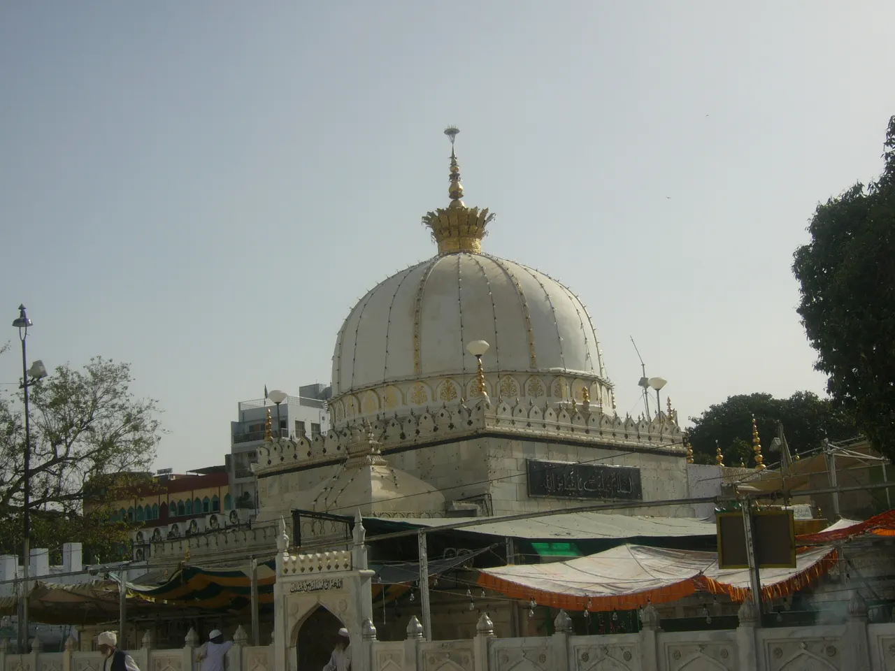 The marble domes and gateway of Ajmer Sharif Dargah crowded with pilgrims