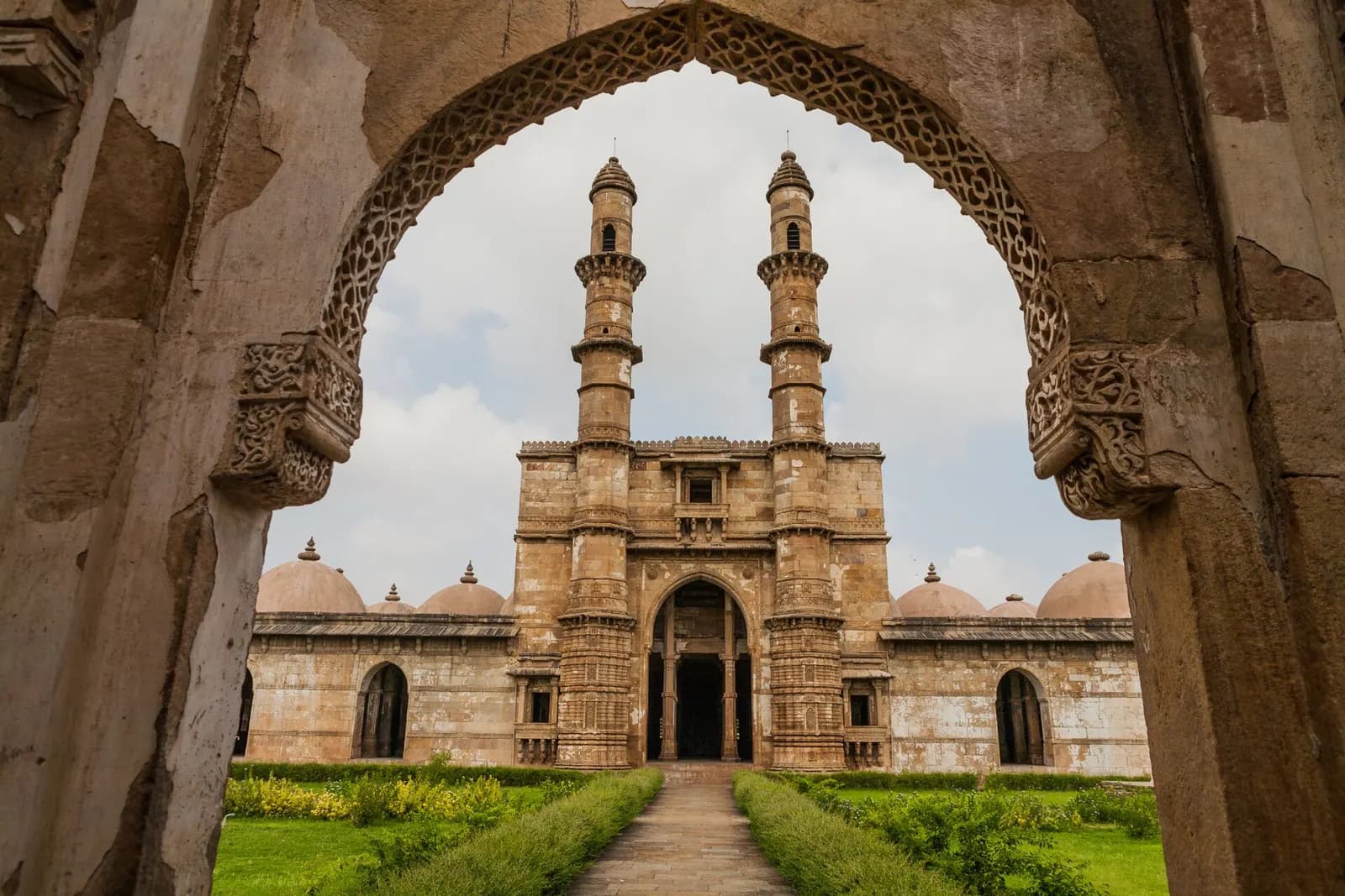 The pillared Jama Masjid of Champaner with its twin minarets below Pavagadh hill