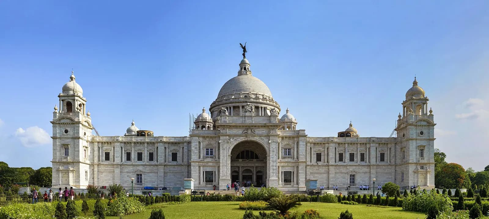 The white marble Victoria Memorial in Kolkata seen across its formal gardens