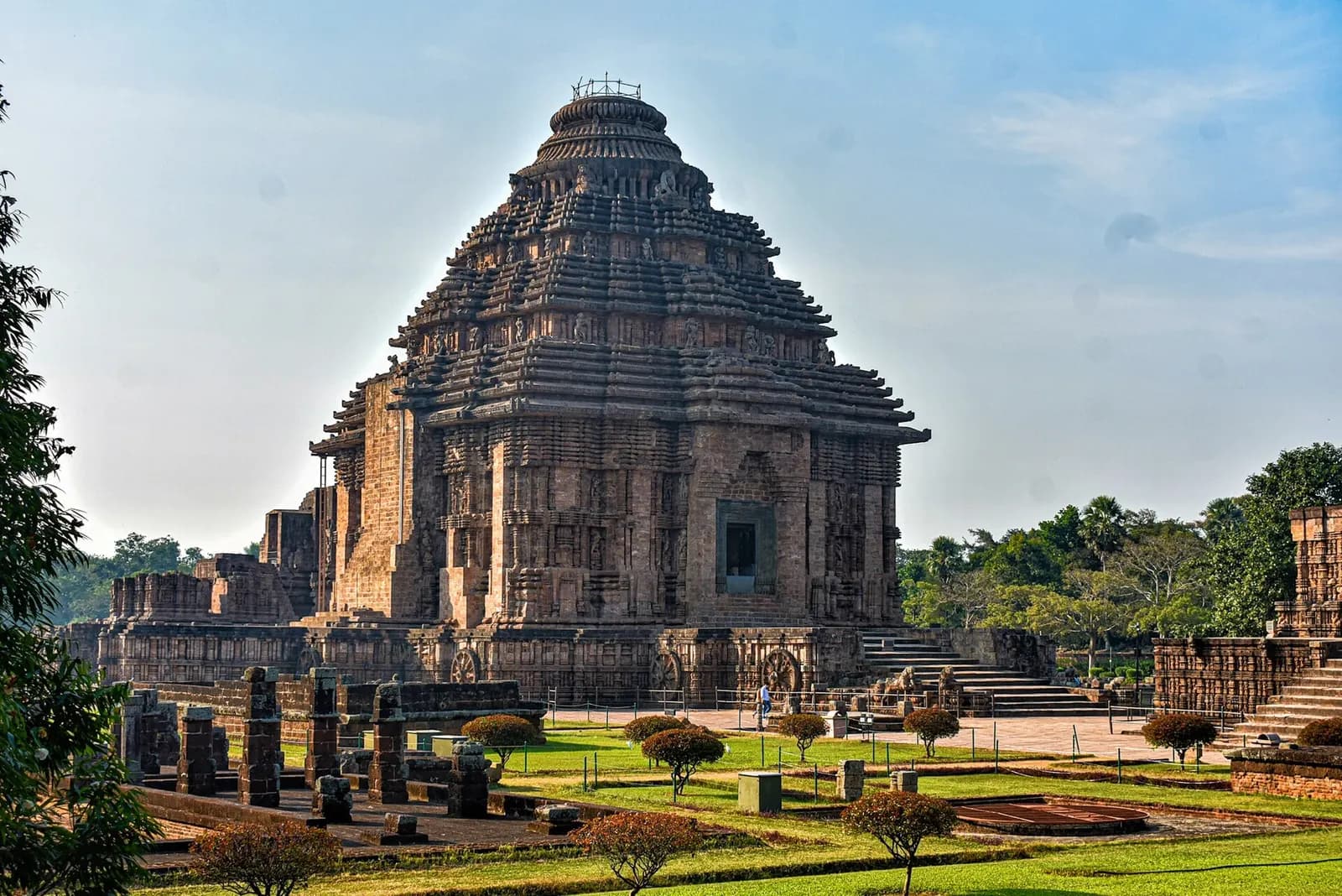 A carved stone chariot wheel on the plinth of the Konark Sun Temple in Odisha