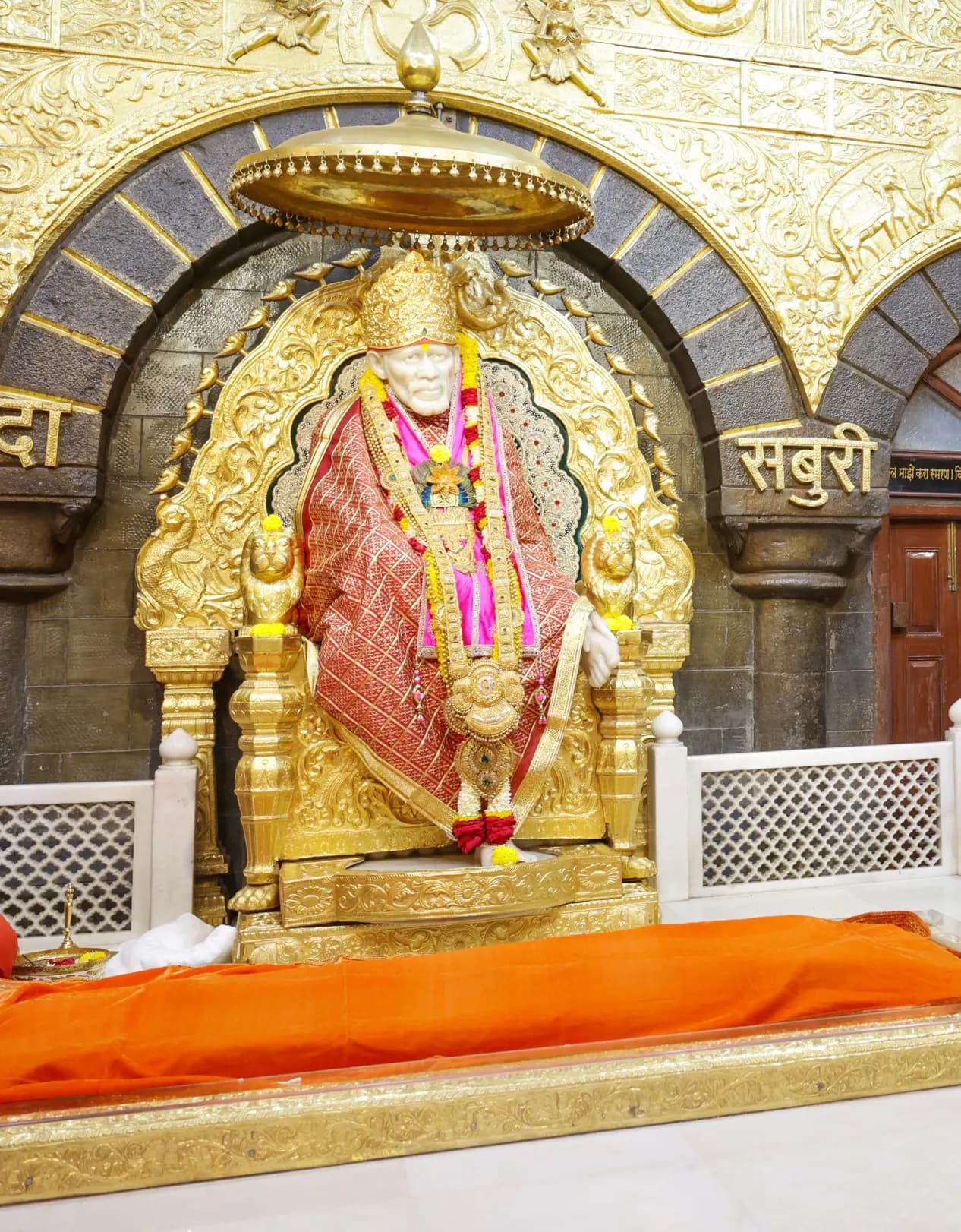 The white Samadhi Mandir of Sai Baba in Shirdi with pilgrims outside