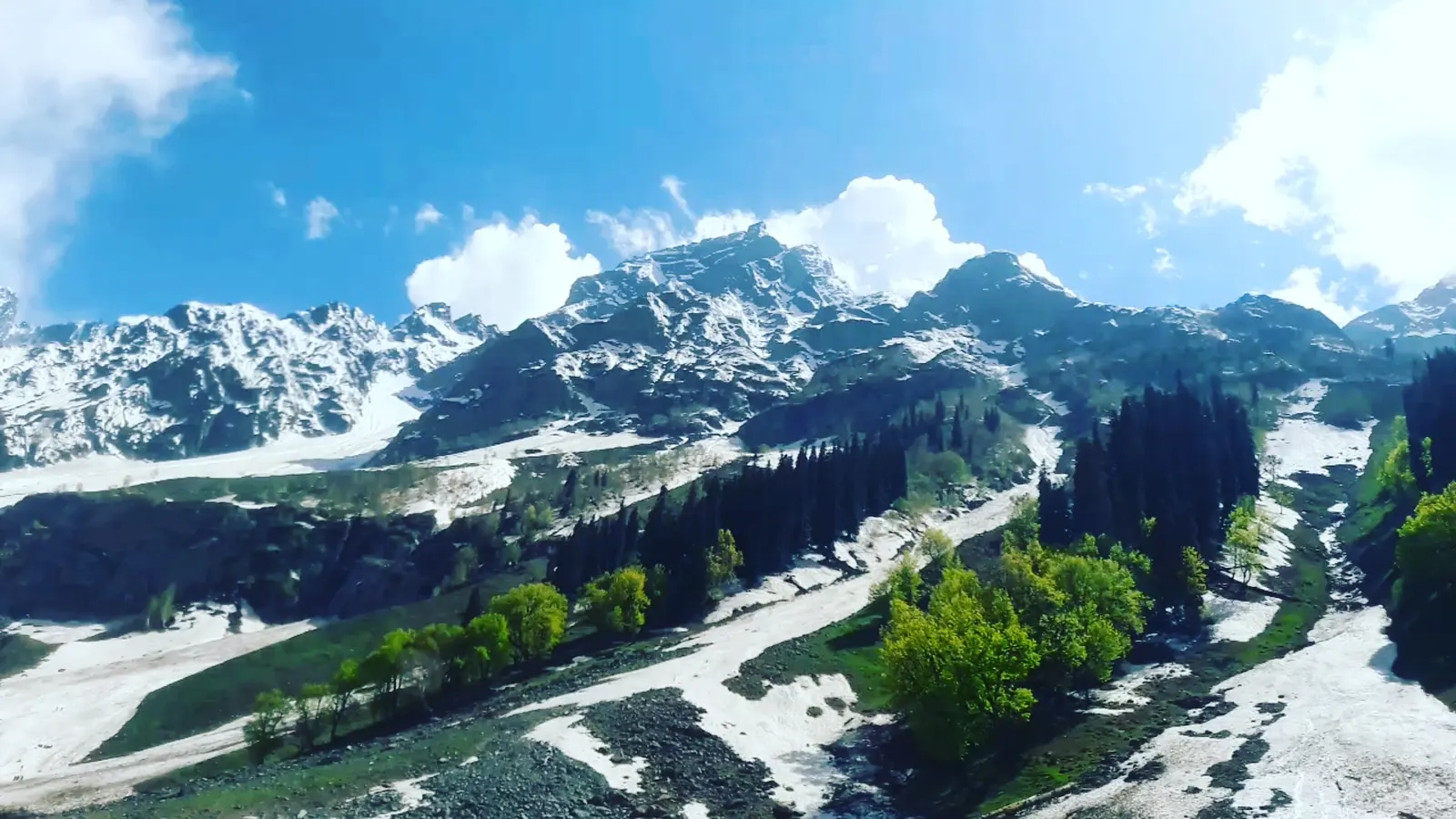 The Sindh river and green meadows of Sonamarg with snow peaks above