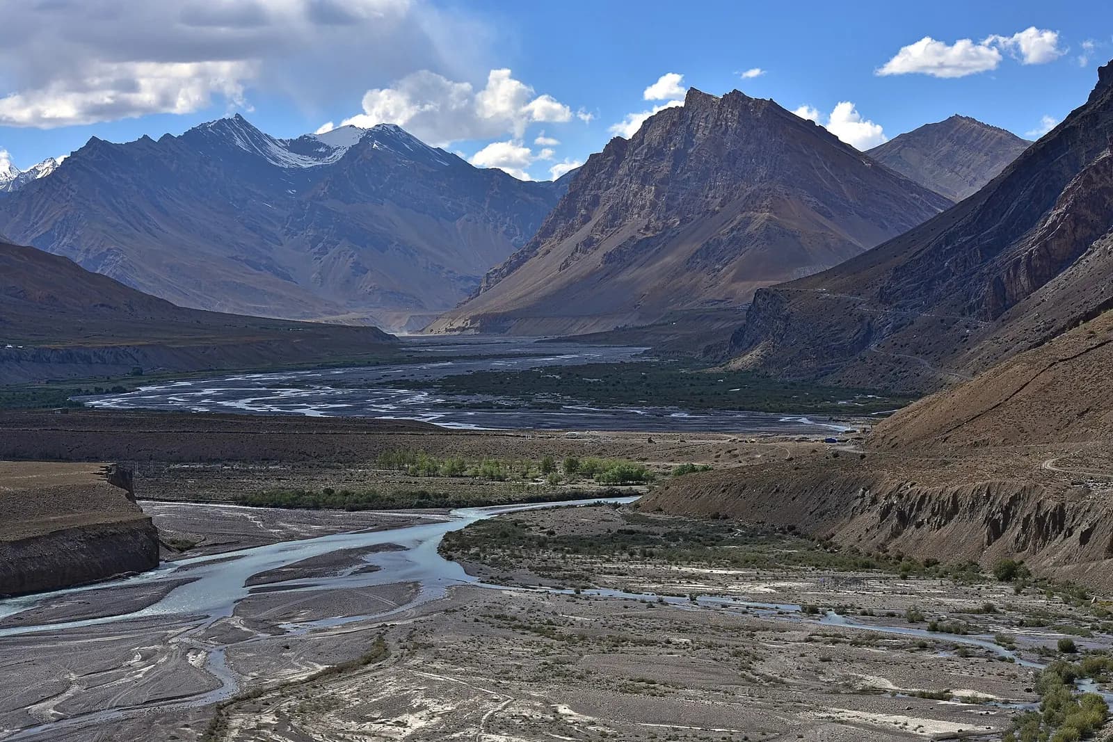Key Monastery stacked on a hill above the Spiti river valley under a deep blue sky