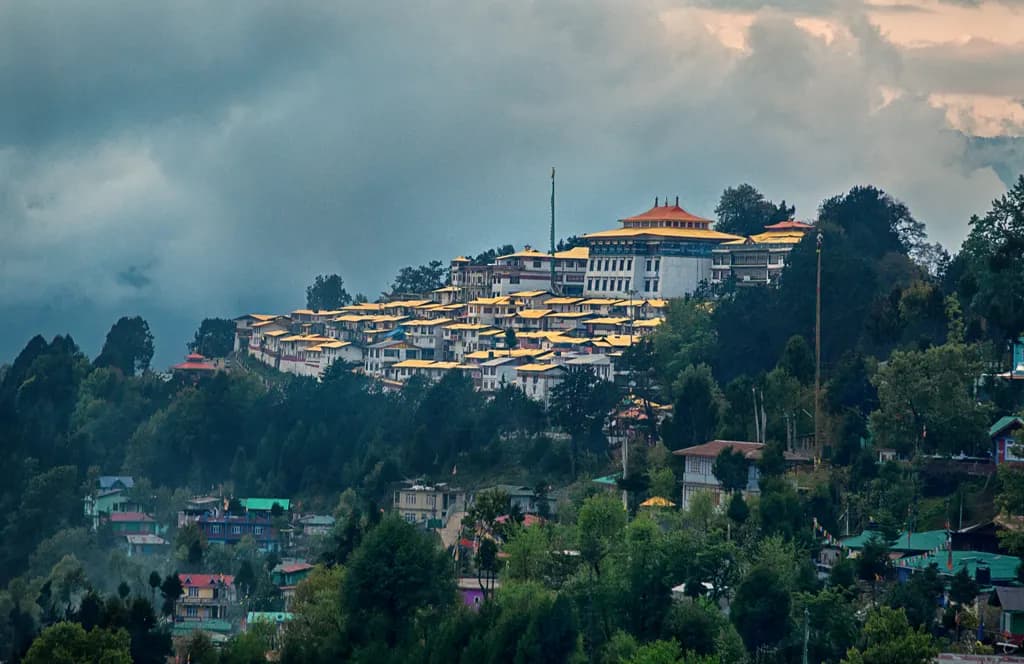Whitewashed walls and golden roofs of Tawang Monastery above the Tawang Chu valley