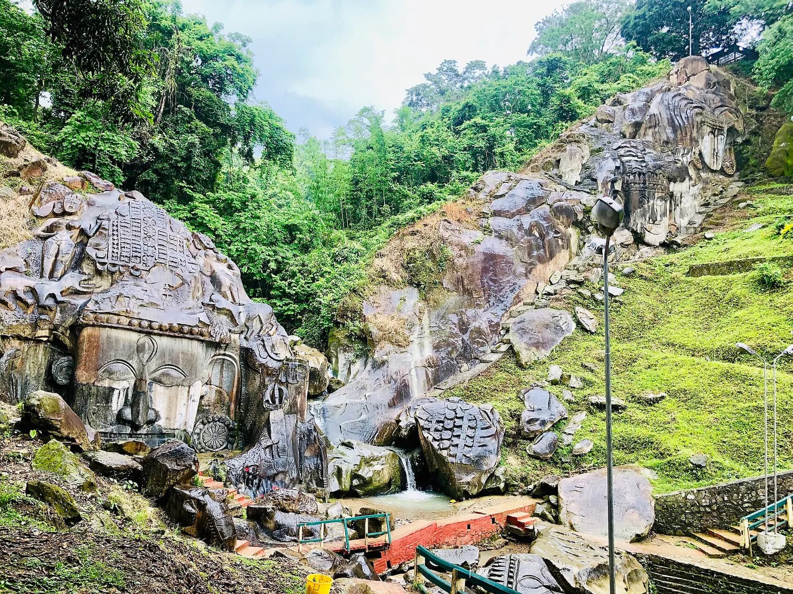 The giant rock-cut Unakotishwara Kal Bhairava head carved into the hillside at Unakoti, Tripura