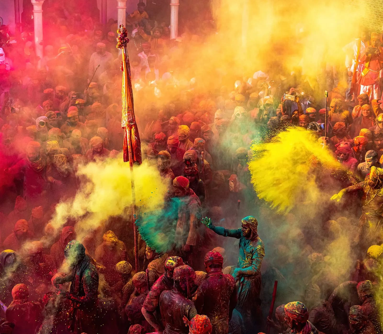 Women of Barsana swinging lathis at men from Nandgaon during Lathmar Holi in the Braj country