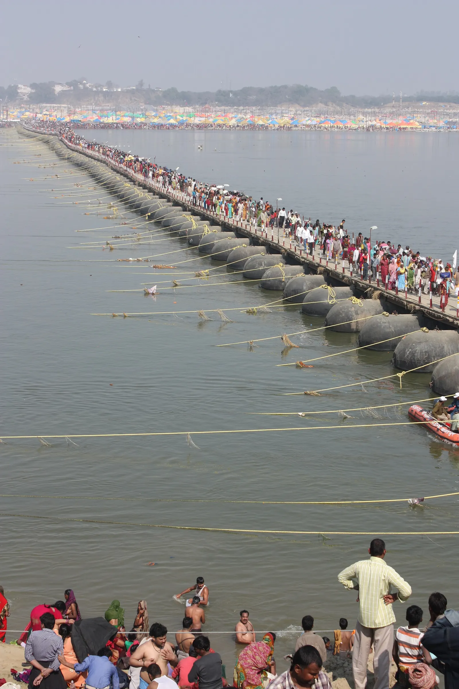 Pilgrims and tents on the Sangam floodplain during the Kumbh Mela at Prayagraj