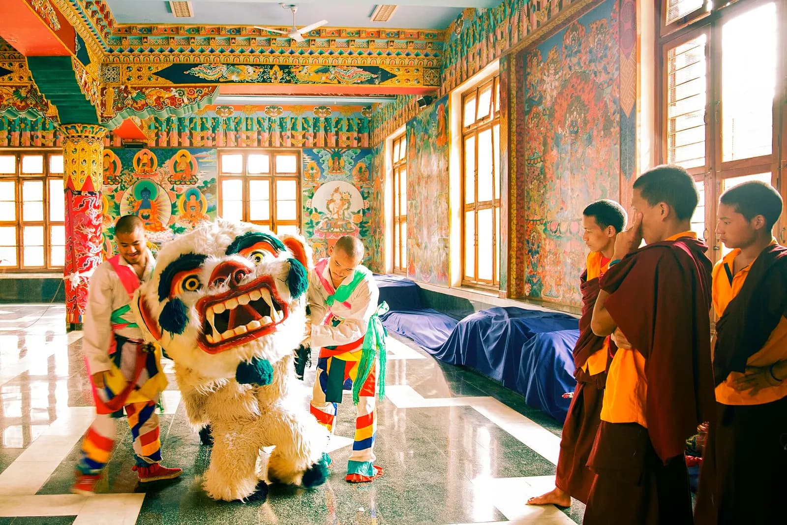 A household altar being prepared with butter lamps and barley offerings for Losar, the Tibetan new year
