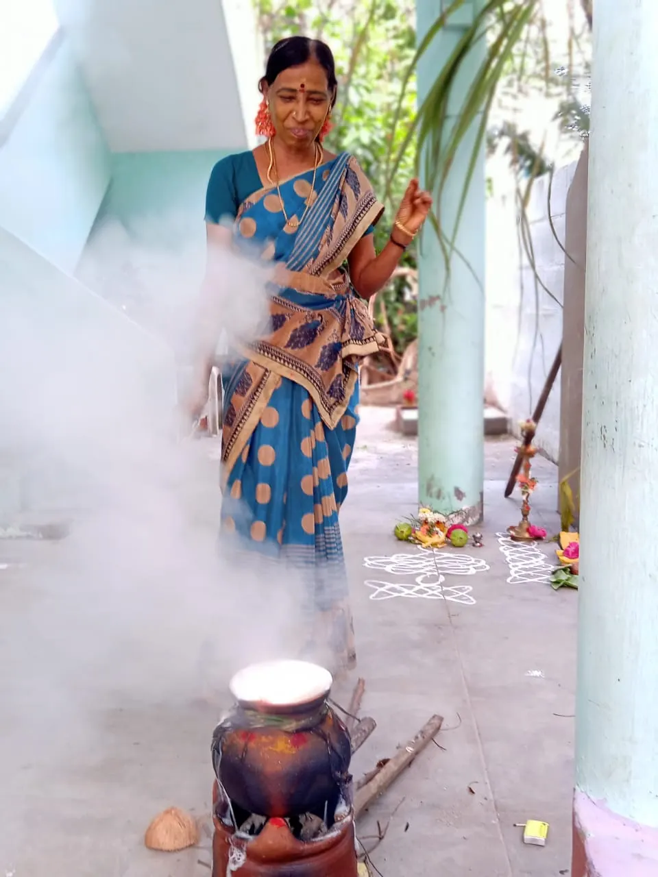 A clay pot of rice and milk boiling over during the Tamil harvest festival of Pongal