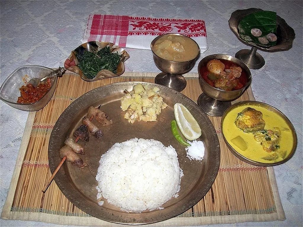 An Assamese thali with rice, khar and side dishes