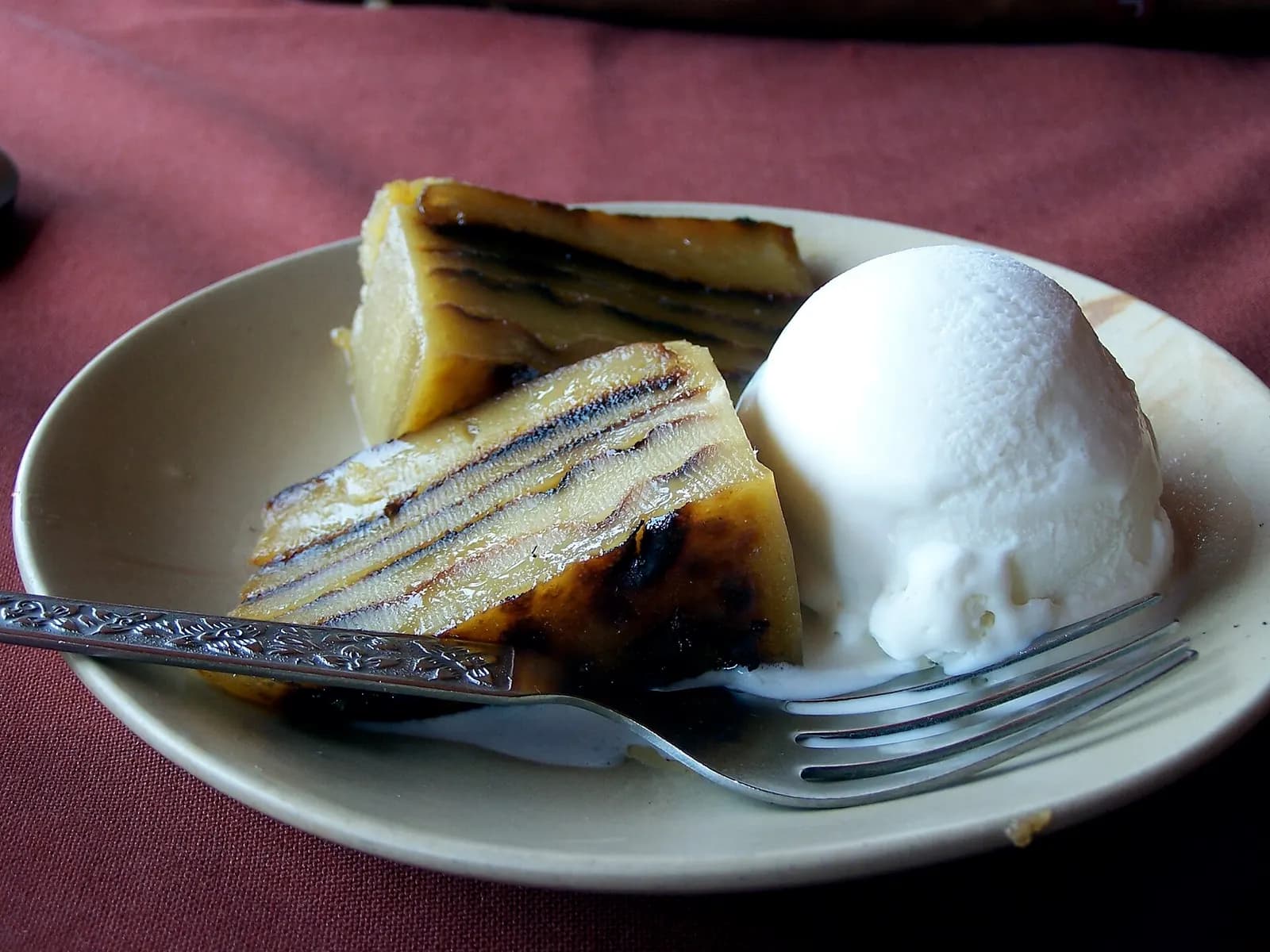 A layered slice of Goan bebinca with ice cream