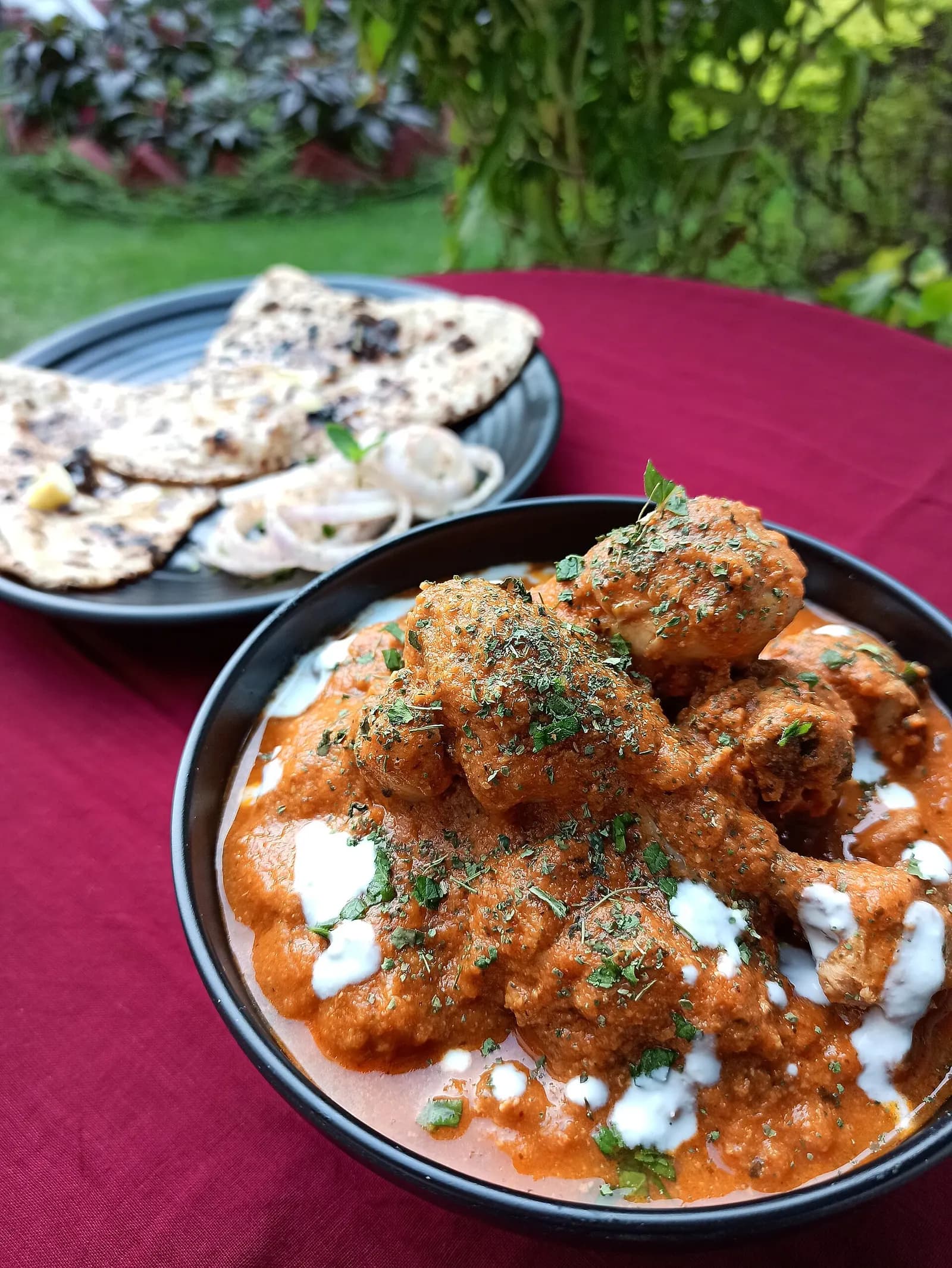 Butter chicken served with naan