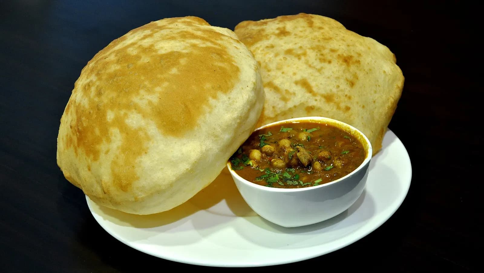Chole bhature with pickled onion and chutney