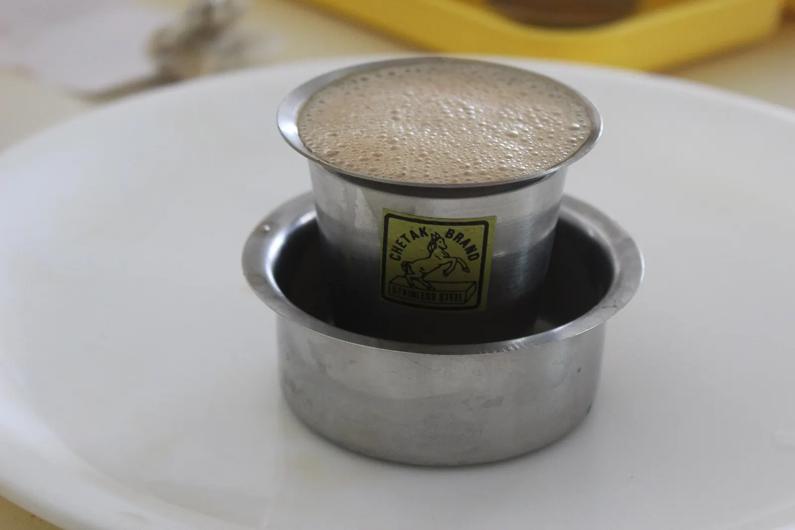 South Indian filter coffee served in a steel tumbler and davara