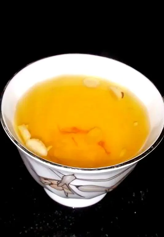 A cup of Kashmiri kahwah tea with saffron and almonds