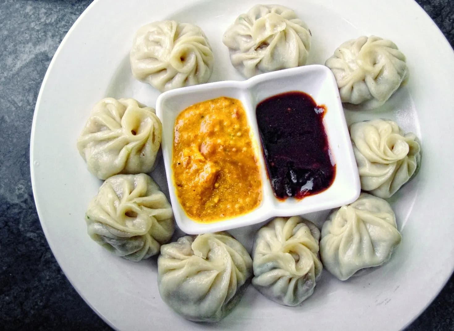 Steamed Himalayan momos with chilli chutney
