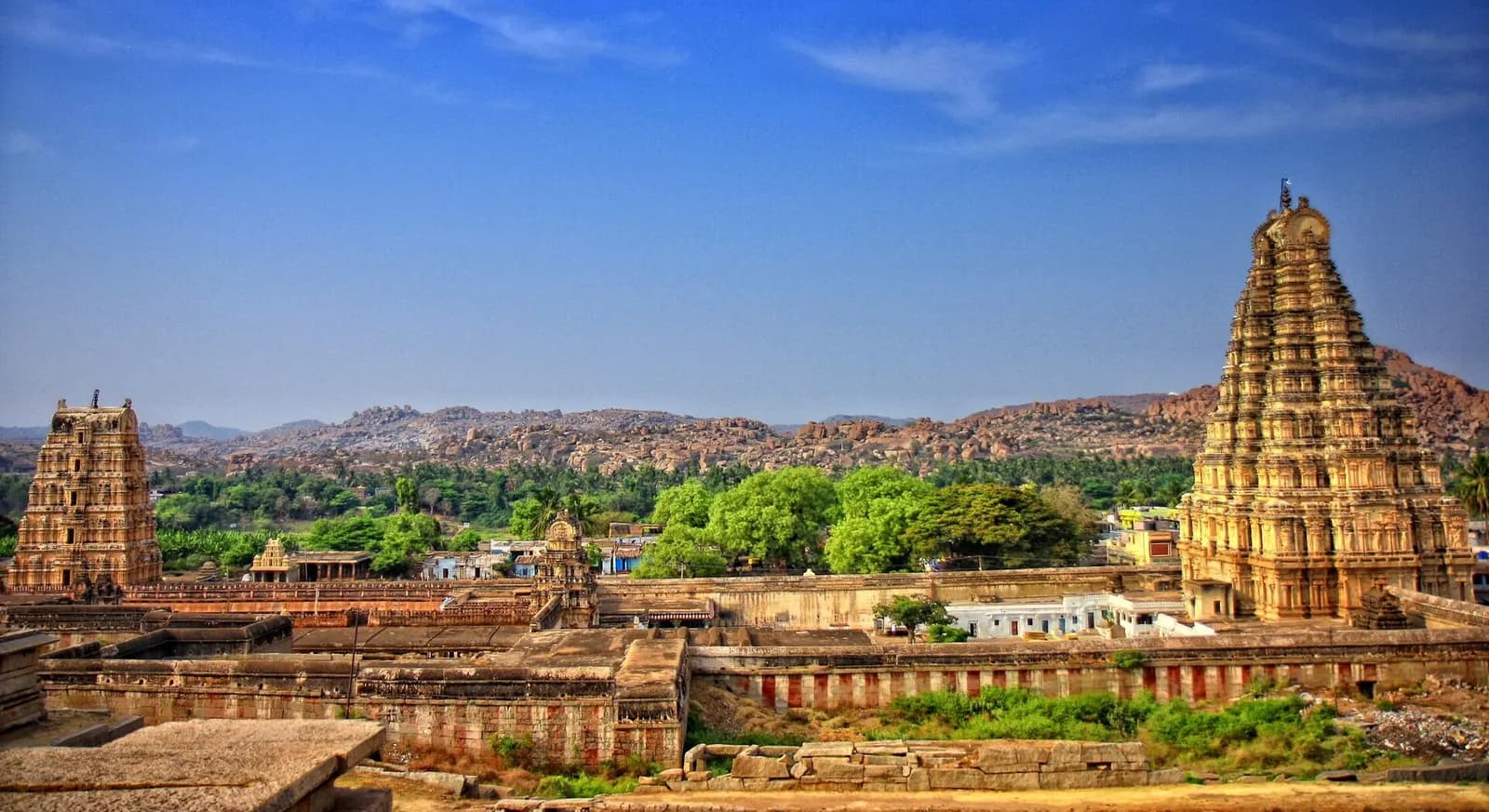 The gopuram of Virupaksha Temple above the boulders of Hampi, Karnataka