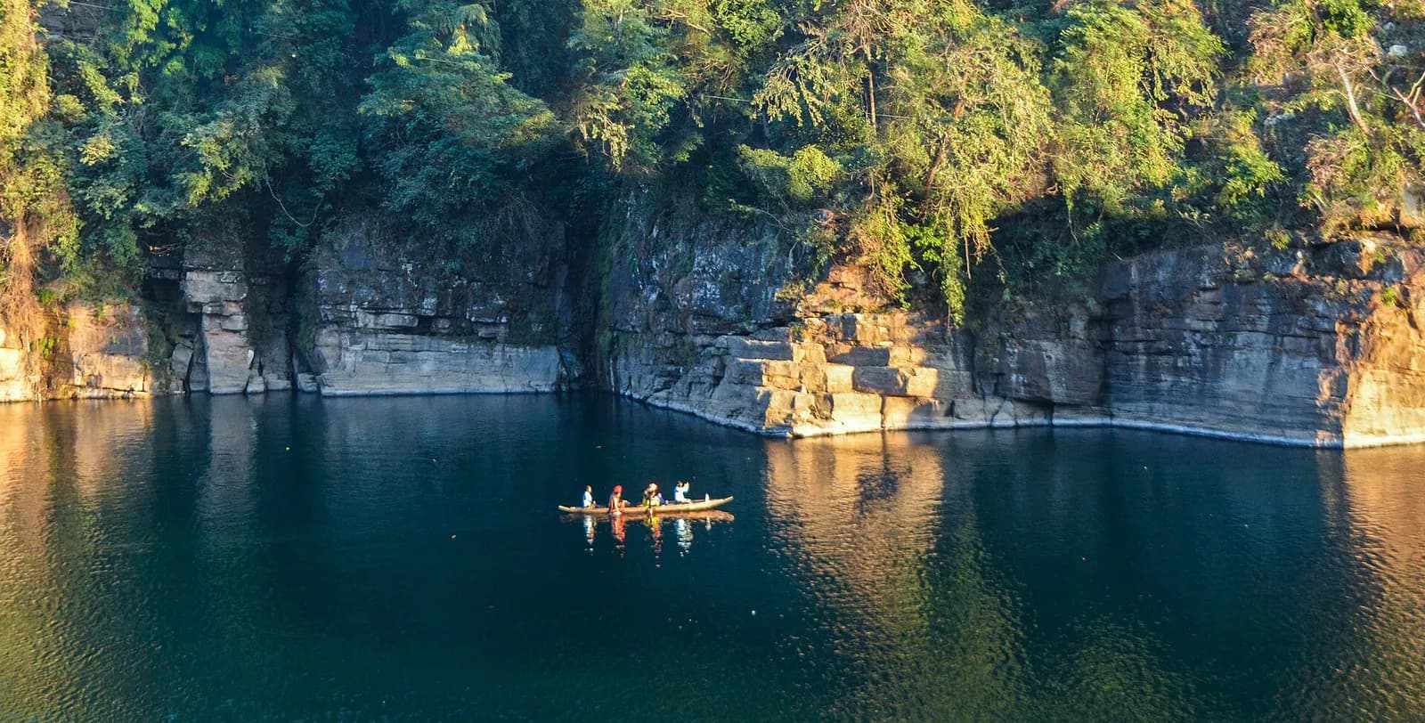 Boats on the clear green Umngot river at Dawki, Meghalaya