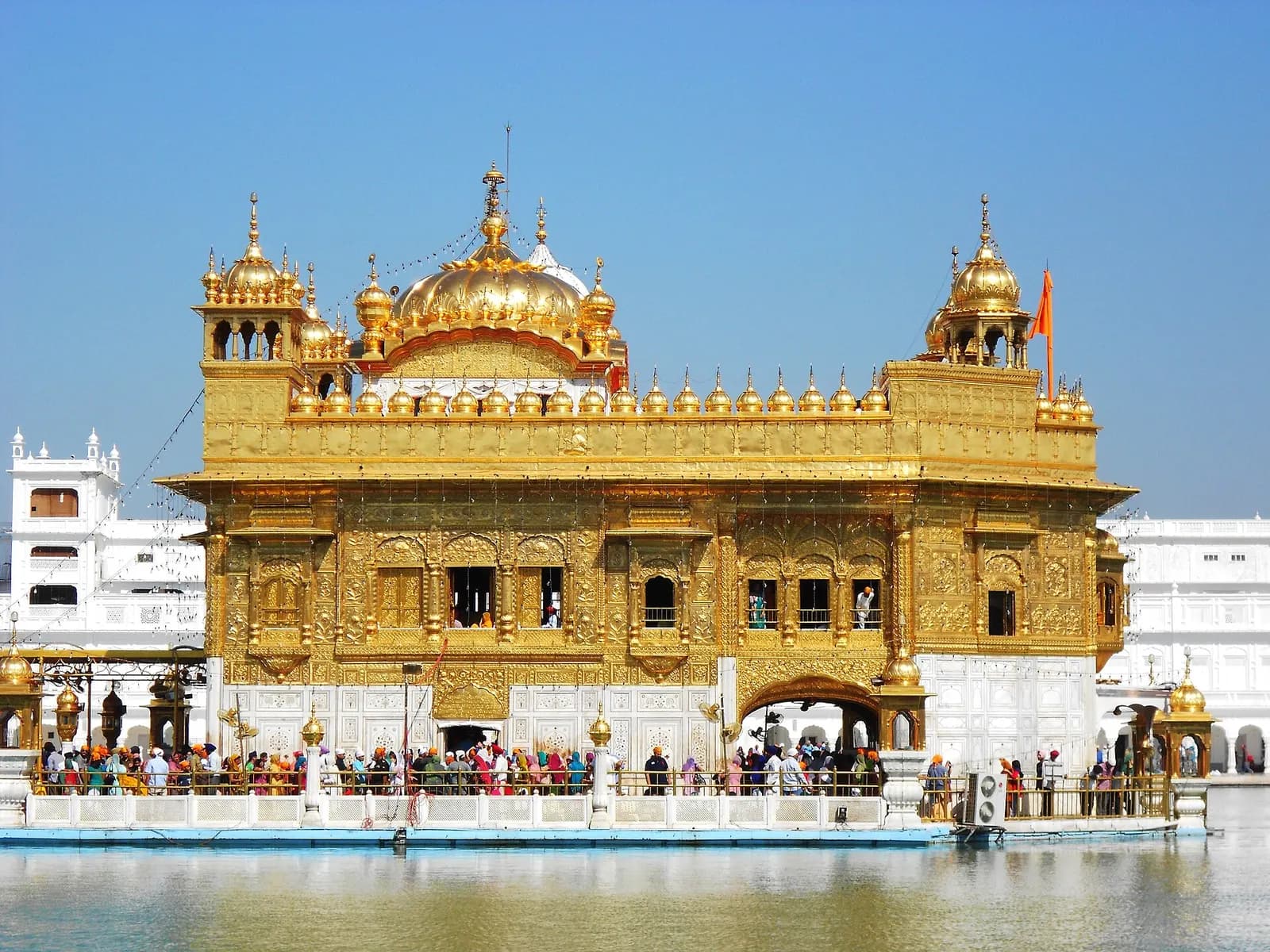 The gilded Harmandir Sahib reflected in its sarovar at Amritsar, Punjab