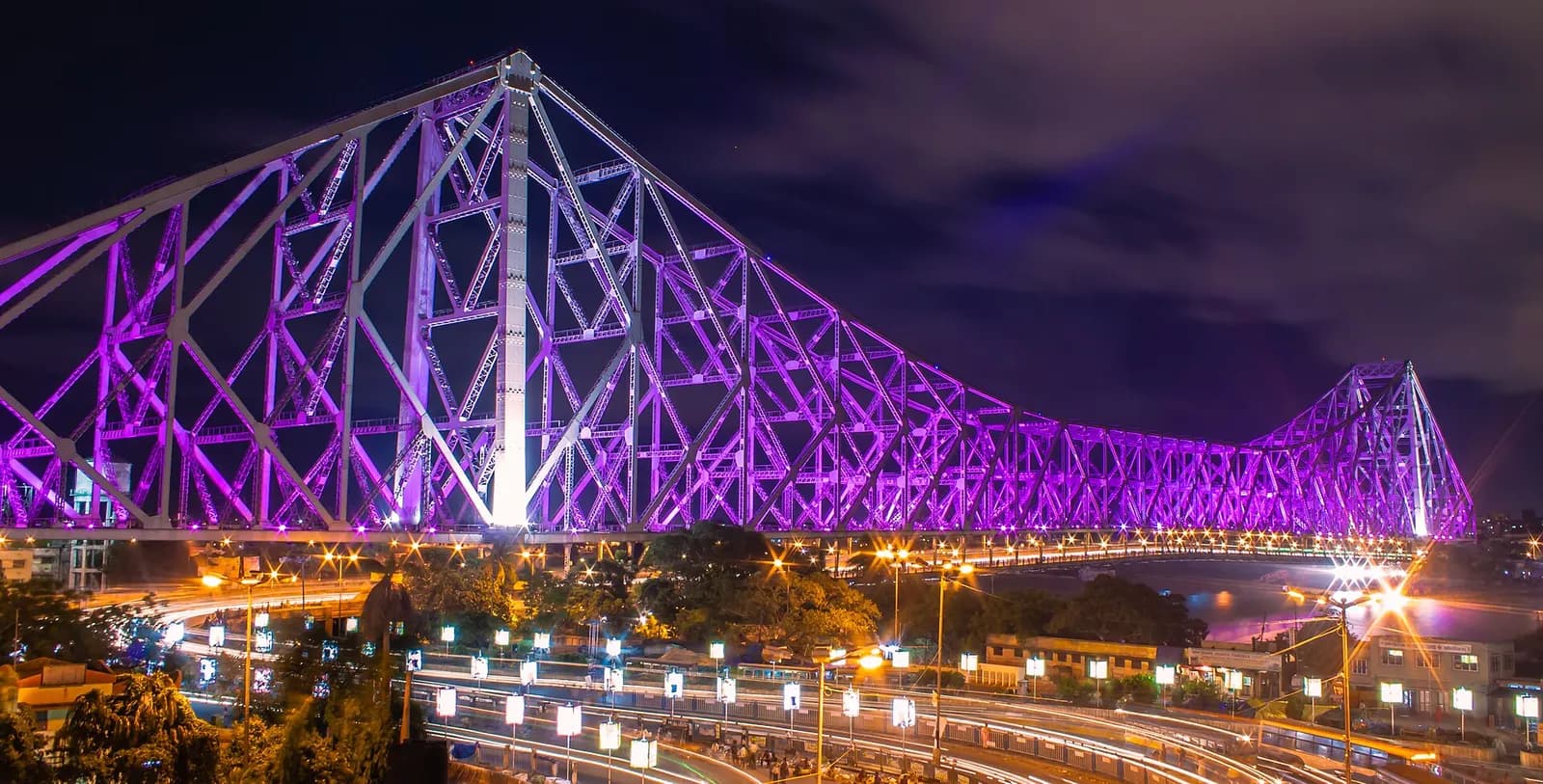 Howrah Bridge lit above the Hooghly river at Kolkata, West Bengal