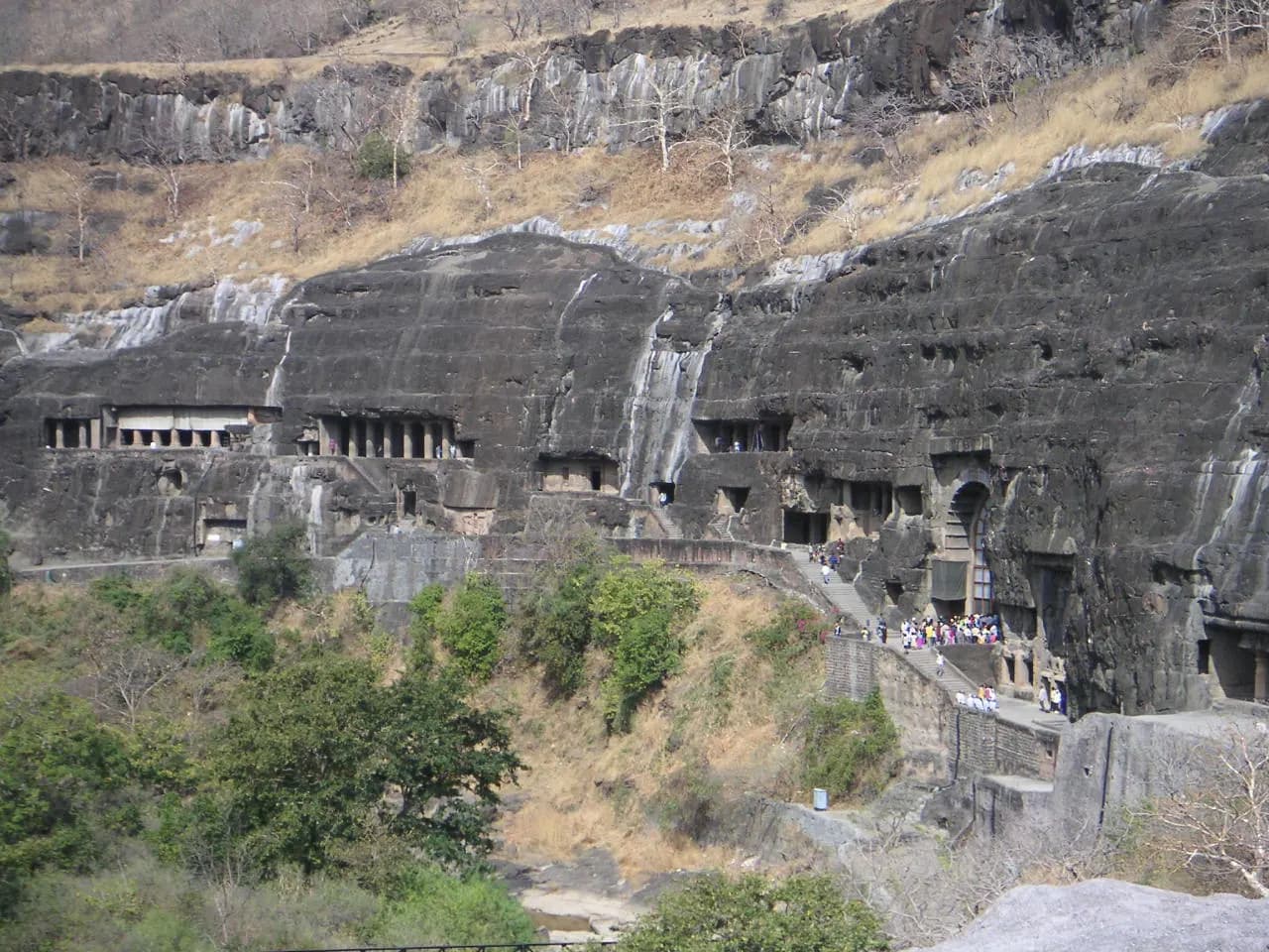 The horseshoe cliff of the Ajanta Caves above the Waghora river