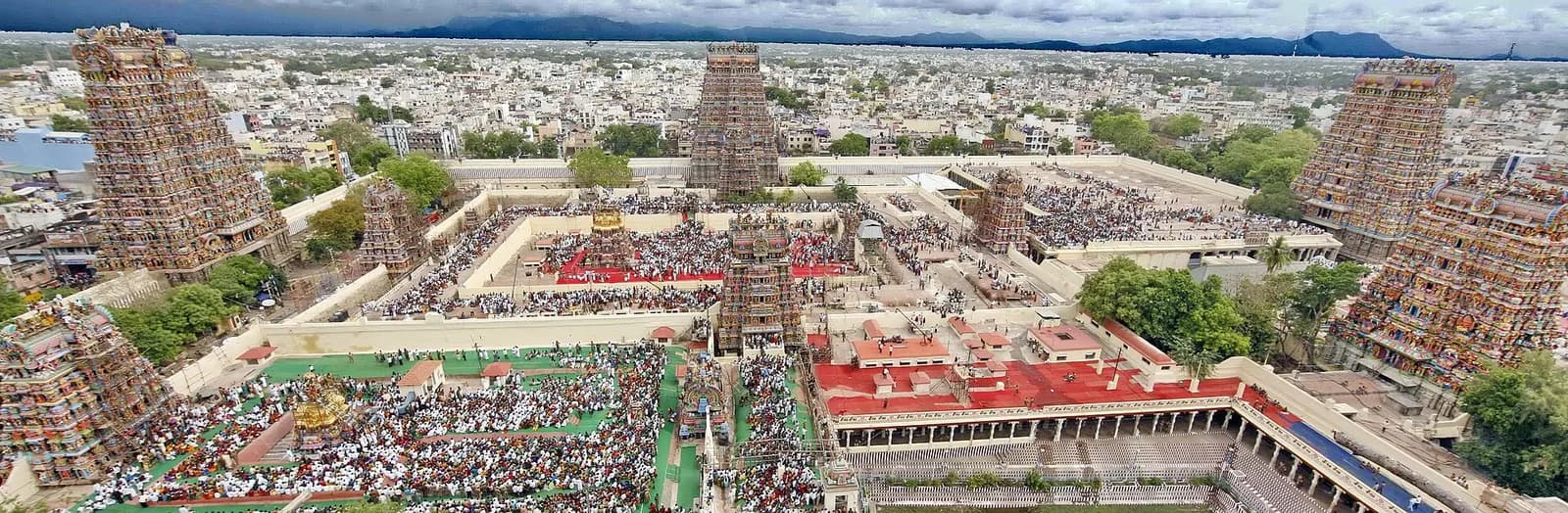 The painted gopuram towers of the Meenakshi Amman Temple rising over Madurai